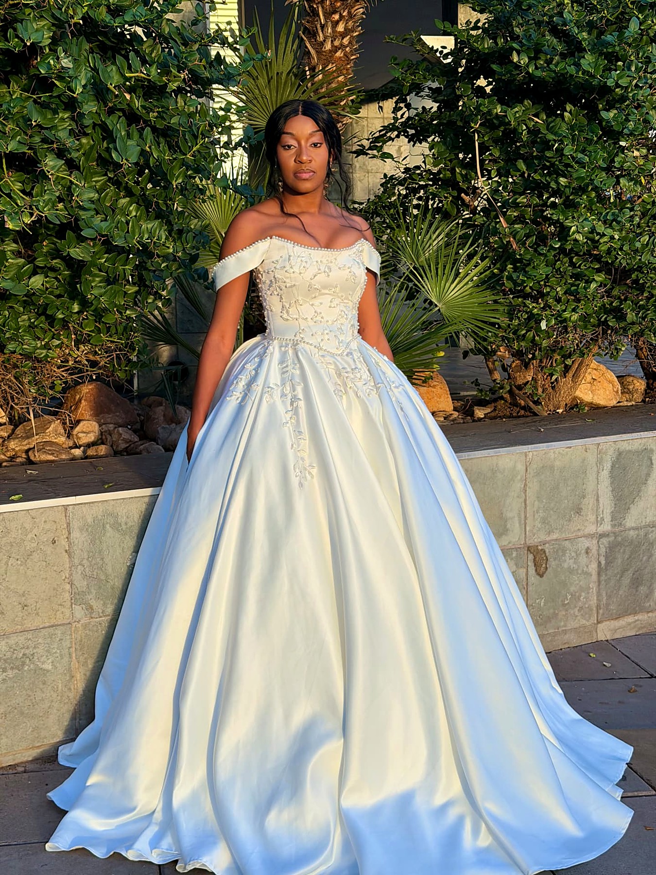Ivory duchesse satin off-shoulder ball gown with beaded leaf embroidery and pearl-trimmed neckline