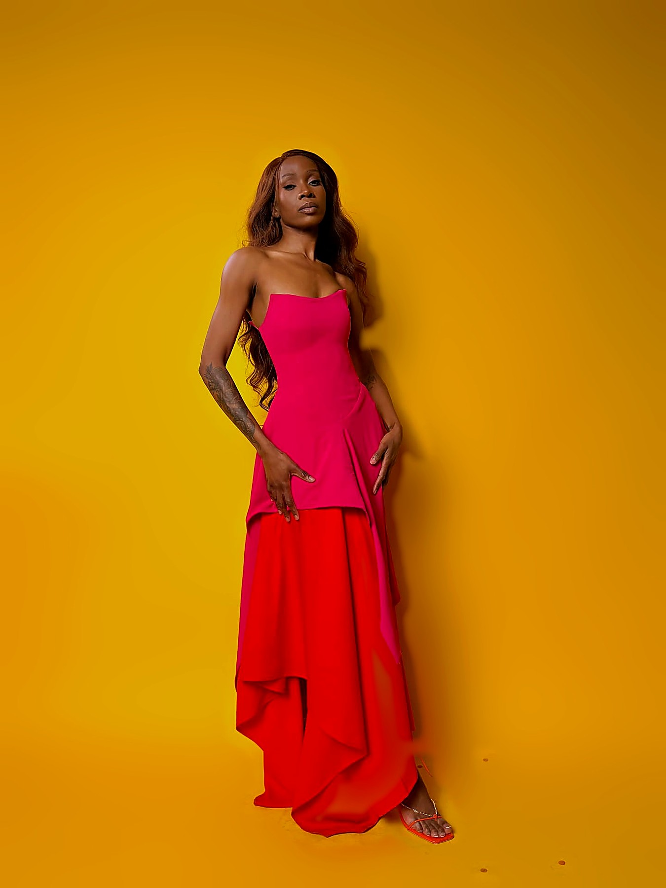 Front view of the fuchsia and red colour-block occasion gown