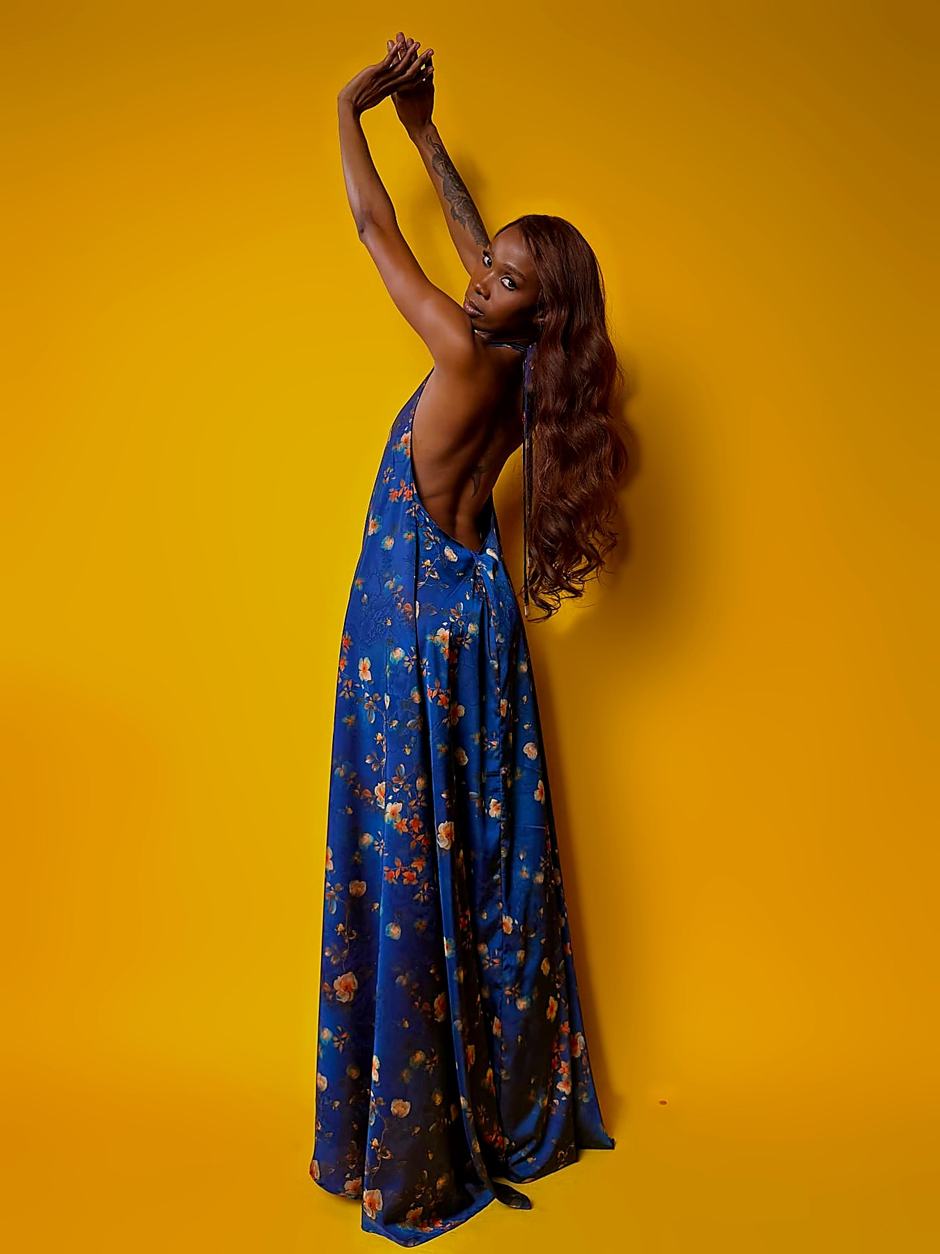 Side view of the cobalt floral maxi showing the open back