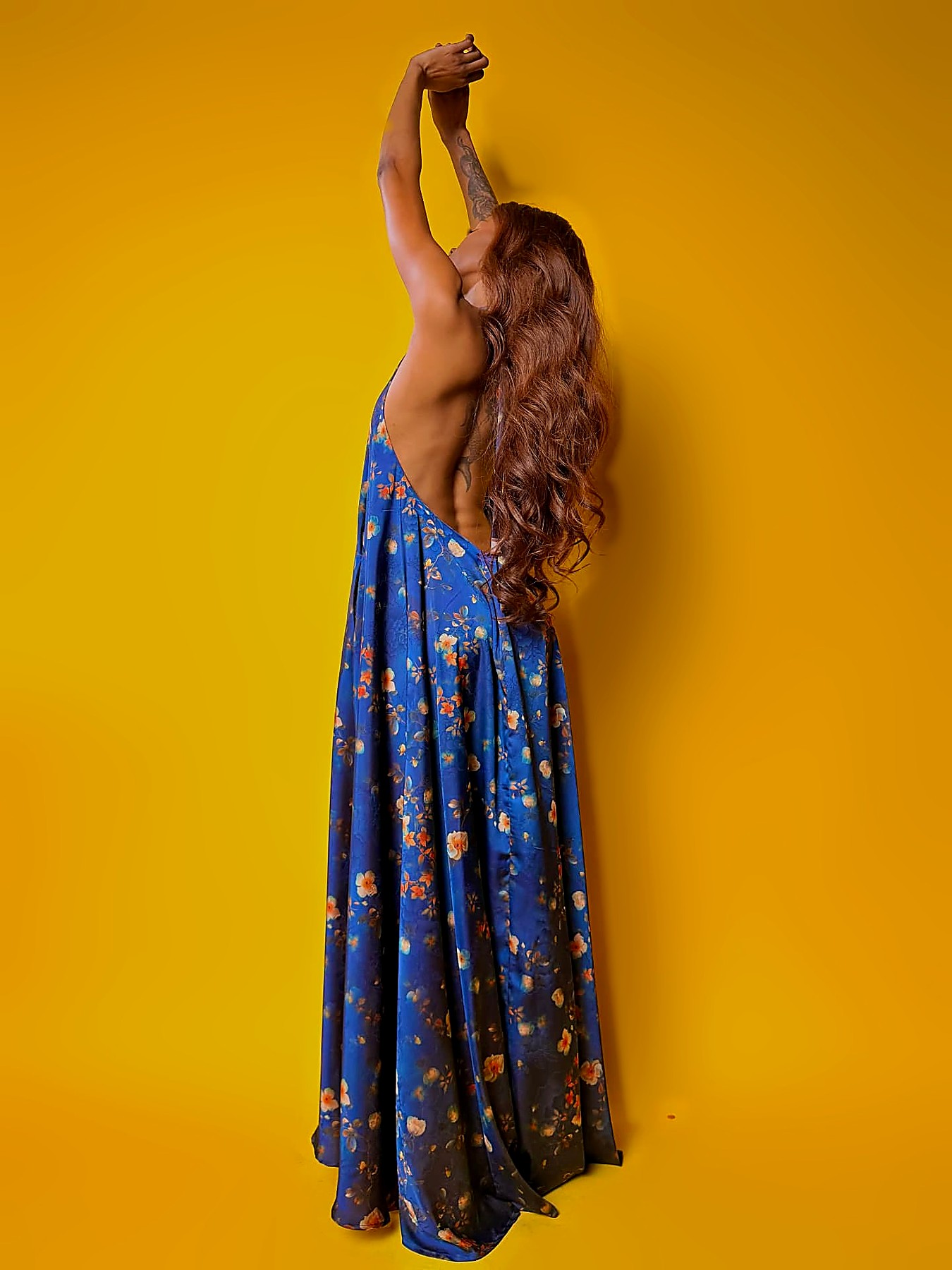 Full skirt of the cobalt floral satin maxi dress in motion