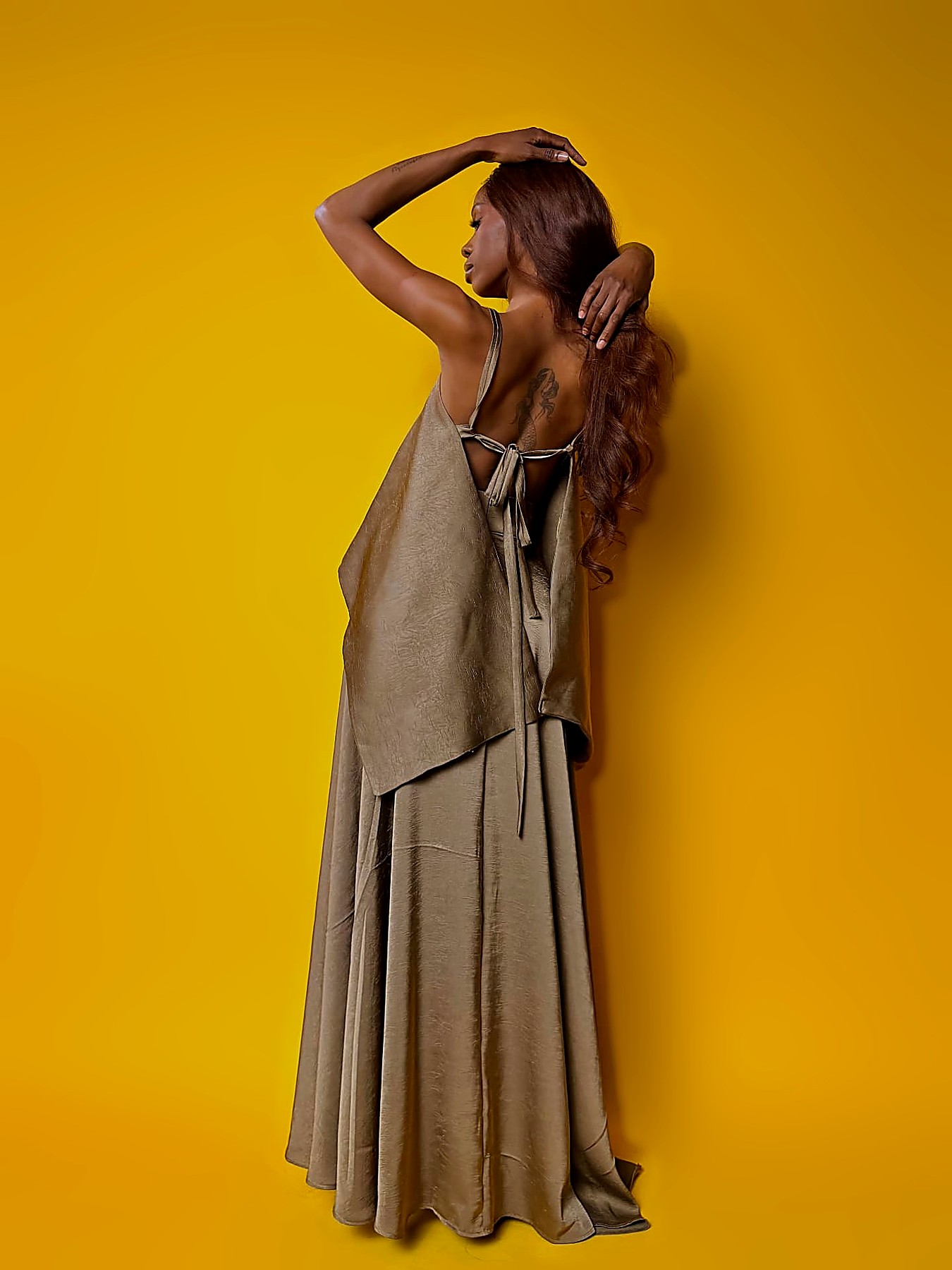 Tie-back detail of the olive silk camisole