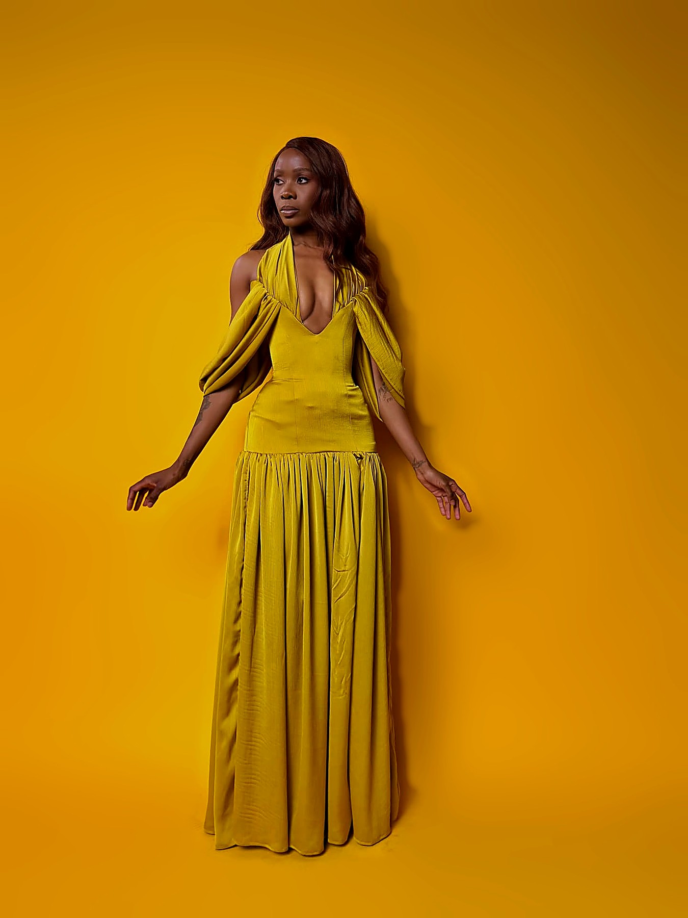 Front view of the chartreuse dropped-waist gathered gown
